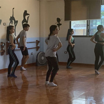 Young dancers are dancing in the studio at one of Johanna Ricuarte's classes